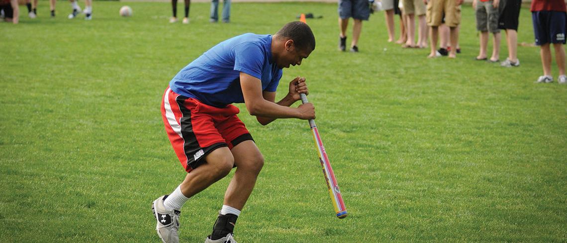 Student playing dizzy bat